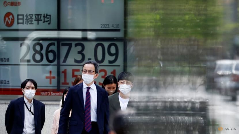 Stocks slip, dollar rises ahead of US inflation data - CNA