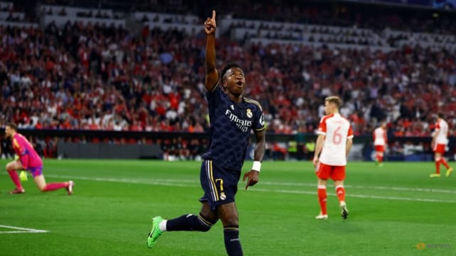 Vinicius Jr's double earns Real Madrid 2-2 draw at Bayern in thriller