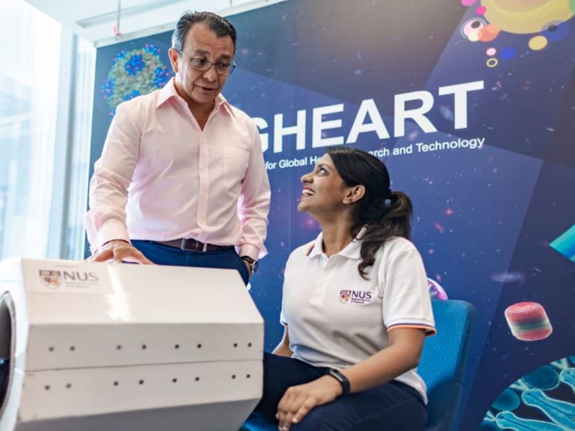 NUS Associate Professor Alfredo Franco-Obergón (left) leading a demonstration of MRegen. He led a team of researchers in developing the medical device that uses magnetic field to regenerate muscle cells.