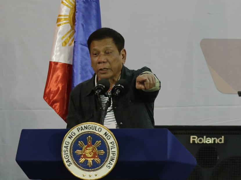 Philippine President Rodrigo Duterte gestures as he delivers his speech before a solidarity dinner with the poor event at a slum area in Manila, Philippines on Thursday, June 30, 2016. Photo: AP