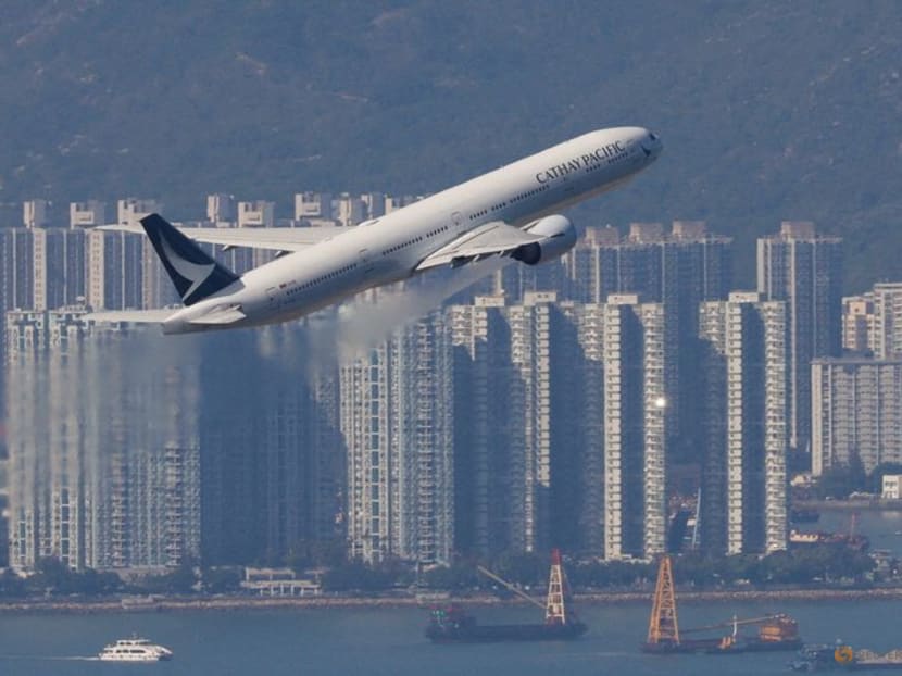 A Cathay Pacific aircraft takes off at the airport, during the coronavirus disease (Covid-19) pandemic in Hong Kong, China, March 31, 2022. A Cathay Pacific aircraft takes off at the airport, during the coronavirus disease (Covid-19) pandemic in Hong Kong, China, March 31, 2022.