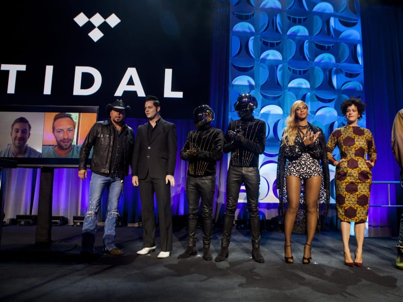 From left: Jason Aldean, Jack White, Daft Punk, Beyonce, Regine Chassagne and Win Butler at the Tidal music service announcement last year. Photo: The New York Times