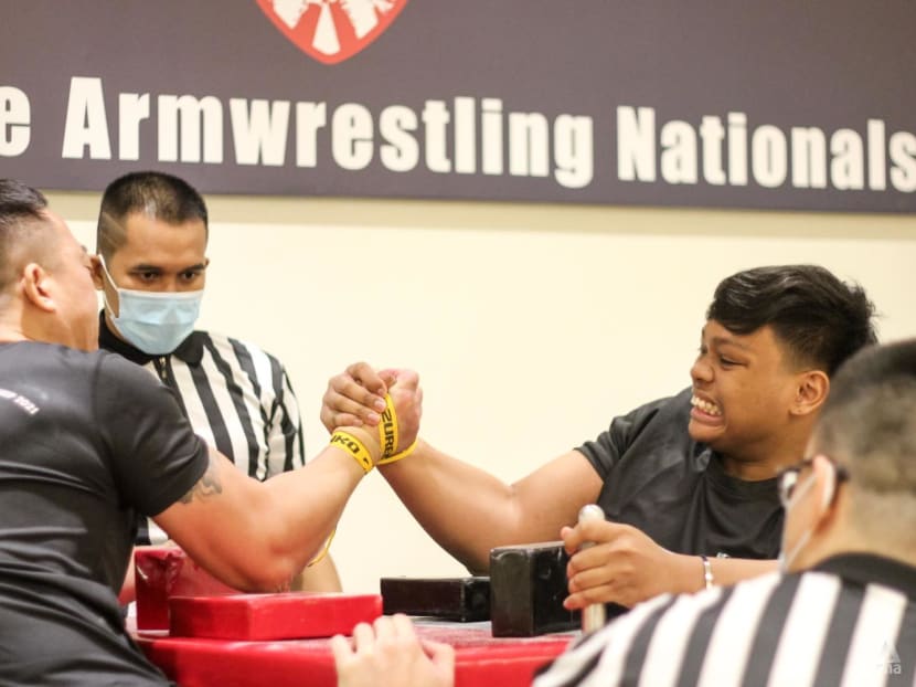 Flexing muscles to grow the sport: Singapore’s arm wrestlers face off at first national championships