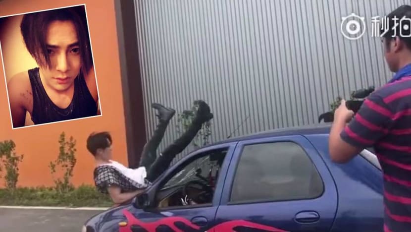 Jiro Wang falls on a car windscreen