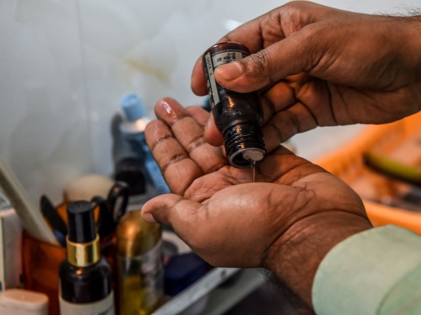 30-year-old communications executive Suraj Balakrishnan prepares to massage his beard with oil at his home in Mumbai. 30-year-old communications executive Suraj Balakrishnan prepares to massage his beard with oil at his home in Mumbai.