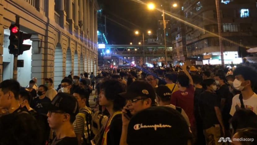 Tear gas fired at Hong Kong protesters at Sham Shui Po police station after student's arrest Tear gas fired at Hong Kong protesters at Sham Shui Po police station after student's arrest
