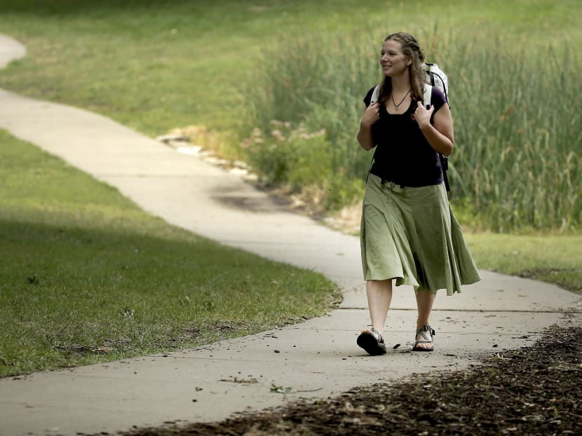 In this photo taken Aug. 28, 2015, Bethany Hughes walks through a park in Kansas City, Mo. as she prepares for her upcoming hike through the Americas. Photo: AP