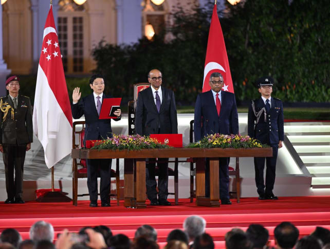 Mr Lawrence Wong (second from left) is sworn-in as Singapore's fourth prime minister. He stands next to President Tharman Shanmugaratnam (centre) and Chief Justice Sundaresh Menon.