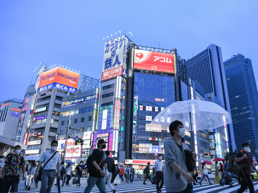 Pedestrians in Tokyo on July 24, 2020. Whoever ultimately emerges from the fierce jockeying within Mr Abe's party will face a clear set of monumental challenges, the author notes. Pedestrians in Tokyo on July 24, 2020. Whoever ultimately emerges from the fierce jockeying within Mr Abe's party will face a clear set of monumental challenges, the author notes.