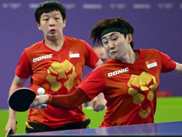 Singapore's Zeng Jian (left) and Feng Tianwei play against Australia in the women's doubles gold medal table tennis match on day 11 of the Commonwealth Latest news in Singapore and around the world at the NEC arena in Birmingham, England, on Aug 8, 2022.