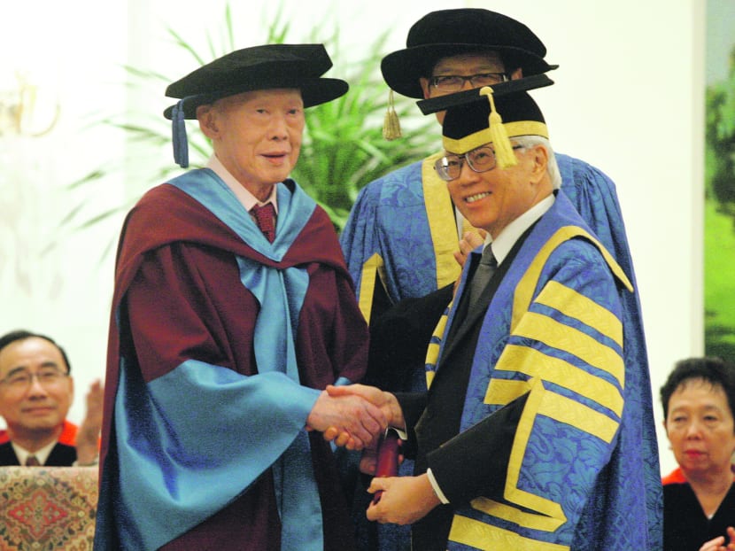 President Tony Tan (right) conferring the honorary degree of Doctor of Laws on Singapore’s first Prime Minister Lee Kuan Yew at the ceremony at the Istana. Photo: Don Wong