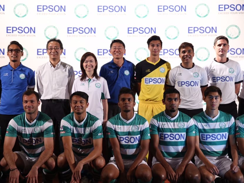 Geylang International Head Coach Hasrin Jailani, MD of Epson Toshimitsu Tanaka, Adviser Tin Pei Ling and Club Chairman Ben Teng pose for a photo with Geylang International players shortly after a press conference to announce a partnership between Epson and Geylang International. Photo: Don Wong/TODAY