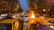 Iran riot police clash with students protesting young woman's death