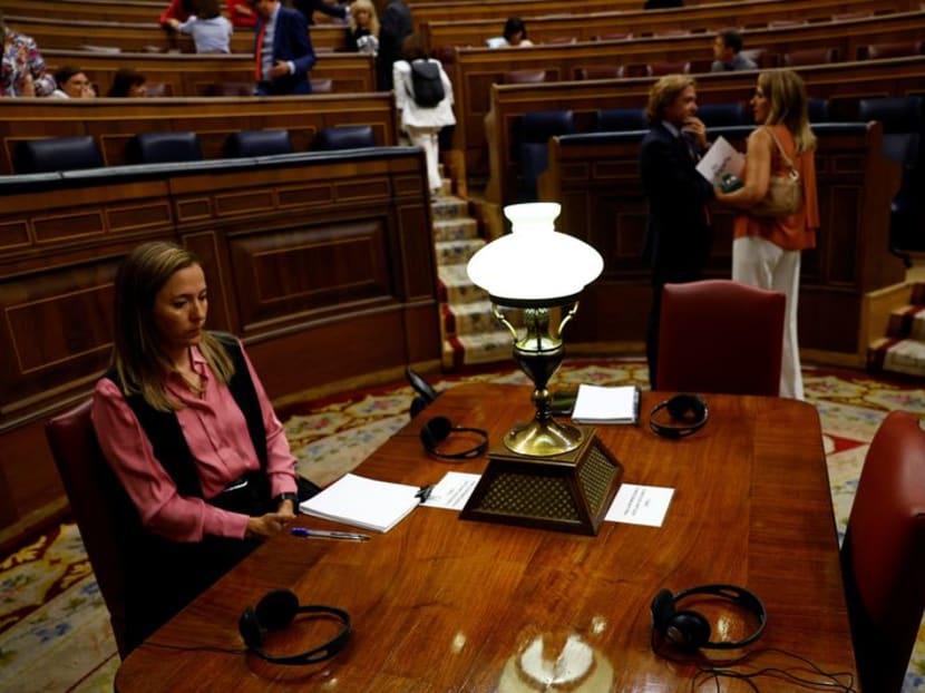 Spain lawmakers don earphones as regional languages make debut in lower house
