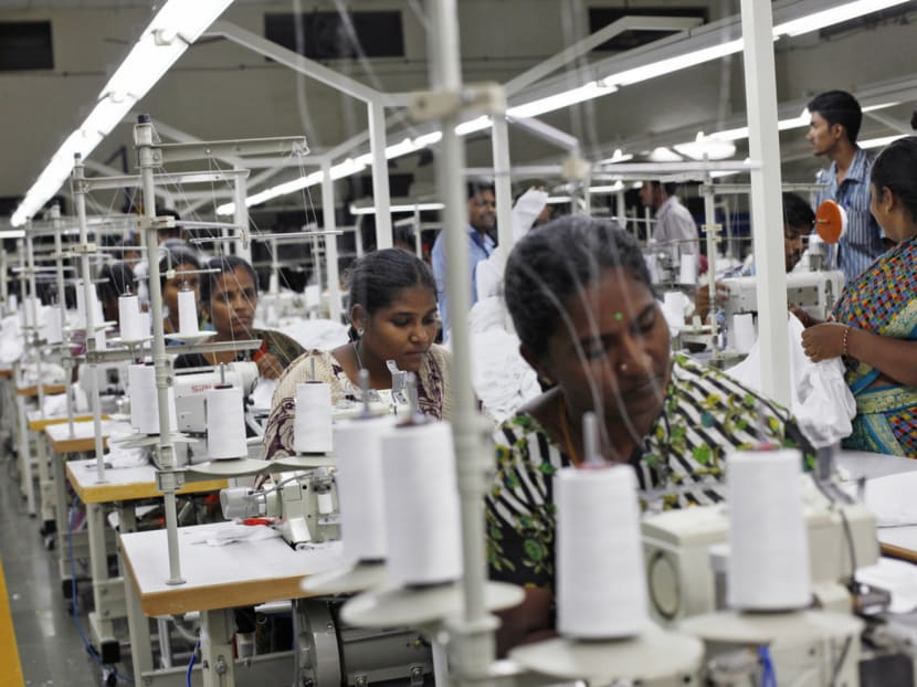 Employees sewing clothes at the Estee garment factory in Tirupur, in the southern Indian state of Tamil Nadu. Some sewers in India earn about US$1,200 (S$1,642) a year. Photo: Reuters