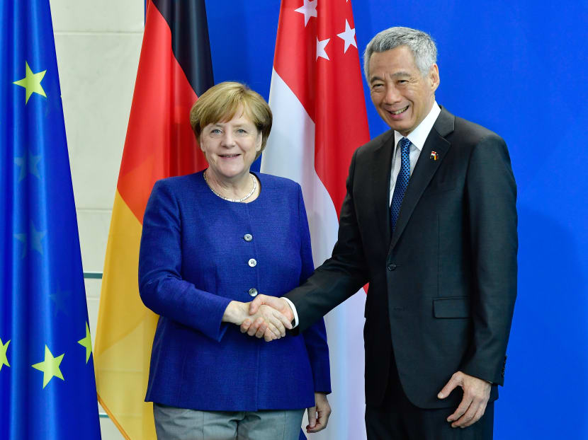 German Chancellor Angela Merkel and Singapore's Prime Minister Lee Hsien Loong shake hands after giving a joint press conference on July 6, 2017 at the Chancellery in Berlin. Photo: AFP