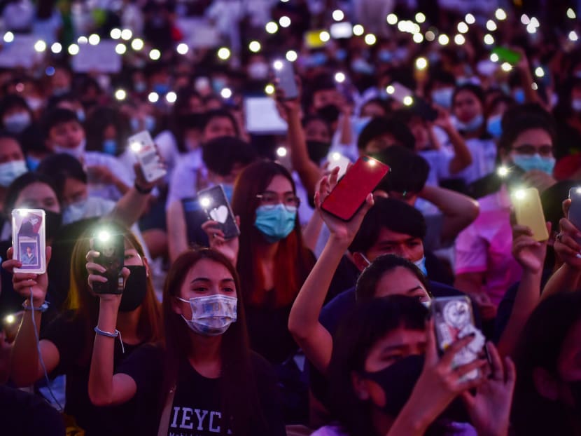 Student protesters use their mobile phones as flashlights during an anti-government rally at King Mongkut's Institute of Technology in Bangkok on Aug 19, 2020.