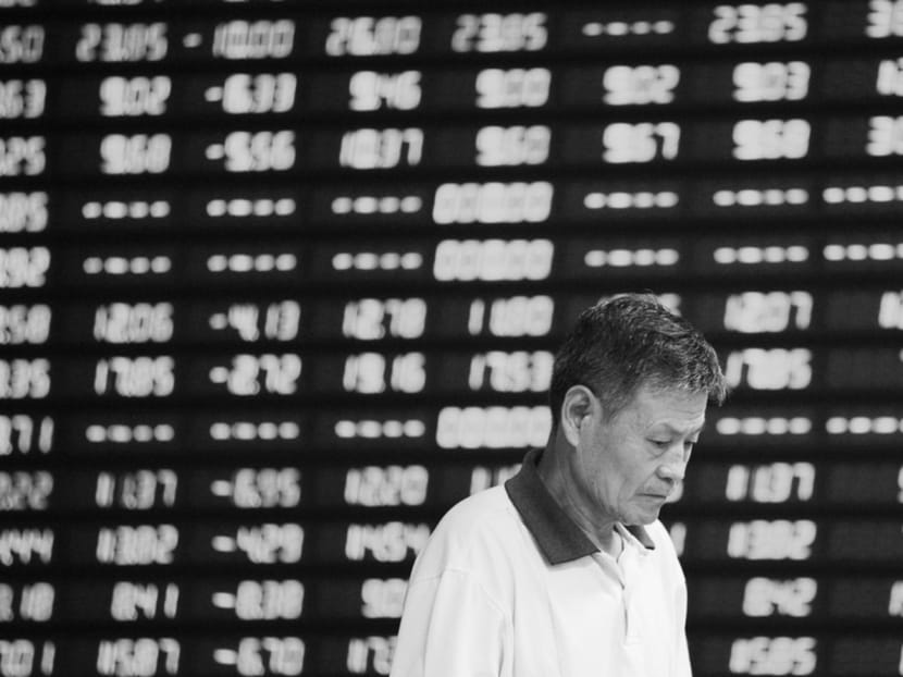 An investor in front of an electronic board showing stock information at a brokerage house in Anhui this week. In response to a 31 per cent plunge in the CSI 300 from its June 12 peak, Chinese regulators have moved aggressively to contain the damage. Photo: Reuters