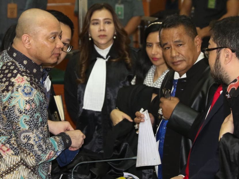 Indonesia's former West Sumatra police chief Teddy Minahasa Putra (left) attends a court hearing in Jakarta on May 9, 2023.
