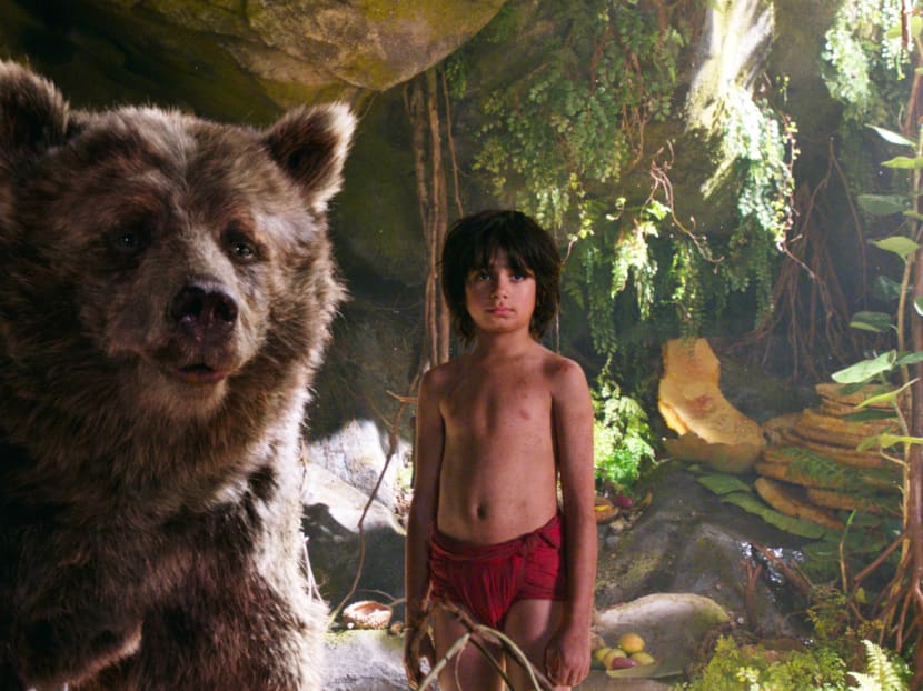 In this image released by Disney, Mowgli, portrayed by Neel Sethi, right, and Baloo the bear, voiced by Bill Murray, appear in a scene from The Jungle Book. Photo: AP
