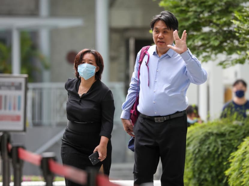Iris Koh (left), founder of anti-vaccine group Healing the Divide, and her husband Raymond Ng (right) at the State Courts on June 23, 2022.