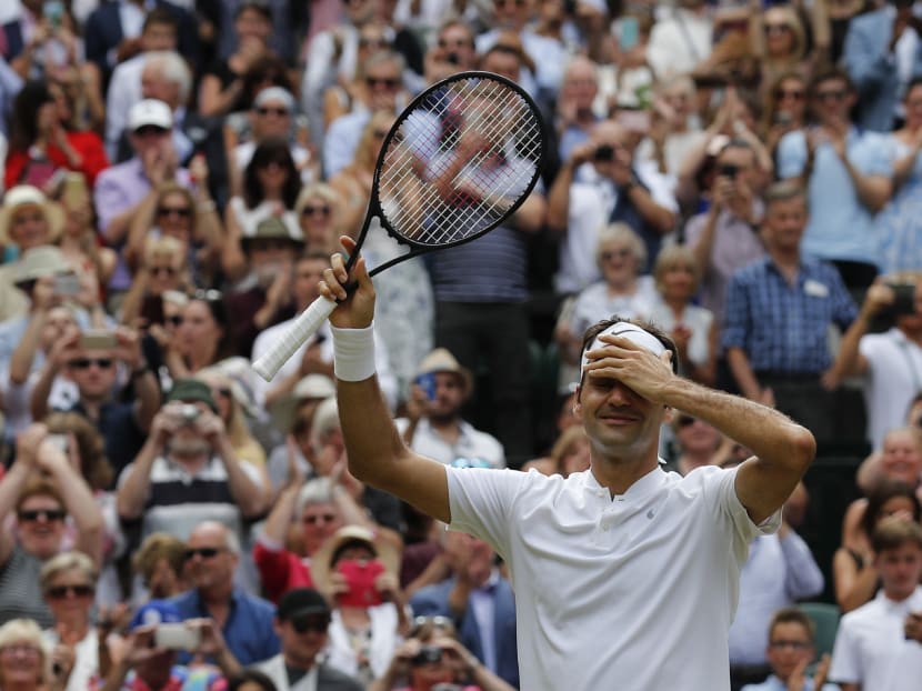 Roger Federer celebrates his eighth victory at Wimbledon. Photo: AFP