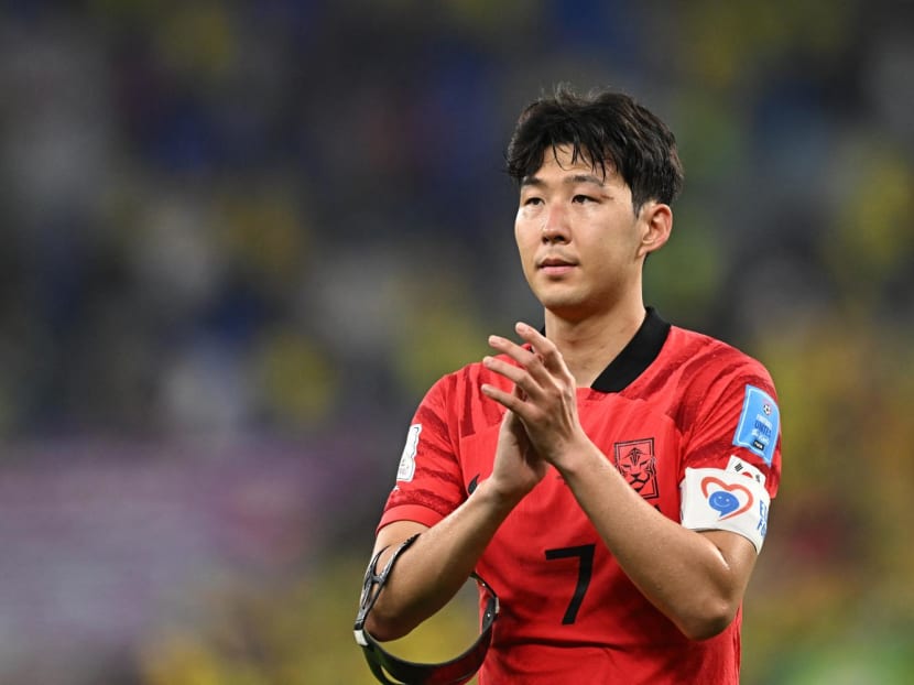 South Korea's midfielder Son Heung-min applauds supporters after his team lost the Qatar 2022 World Cup round of 16 football match between Brazil and South Korea at Stadium 974 in Doha on Dec 5, 2022. South Korea's midfielder Son Heung-min applauds supporters after his team lost the Qatar 2022 World Cup round of 16 football match between Brazil and South Korea at Stadium 974 in Doha on Dec 5, 2022.