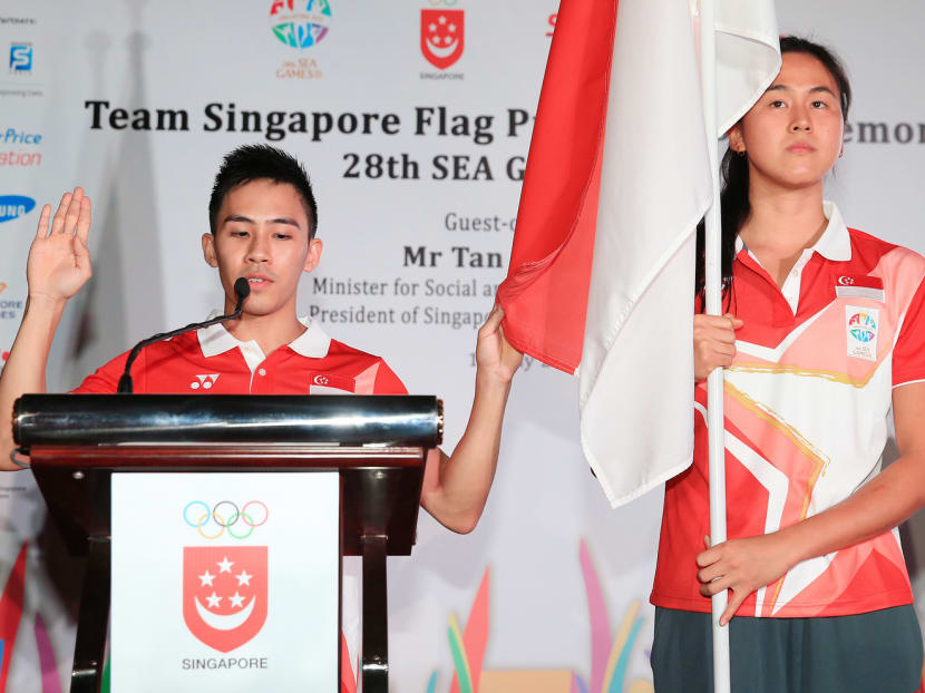 Hoe Wah Toon (left), the pledge taker for Team Singapore at the coming SEA Games, is seeking a podium finish in the men’s vault. Photo: Wee Teck Hian