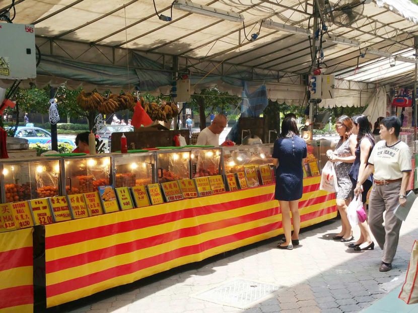 Safeguards should be put in place at pasar malam stalls to ensure customer health. Photo: Ronnie Poon Beng Choon