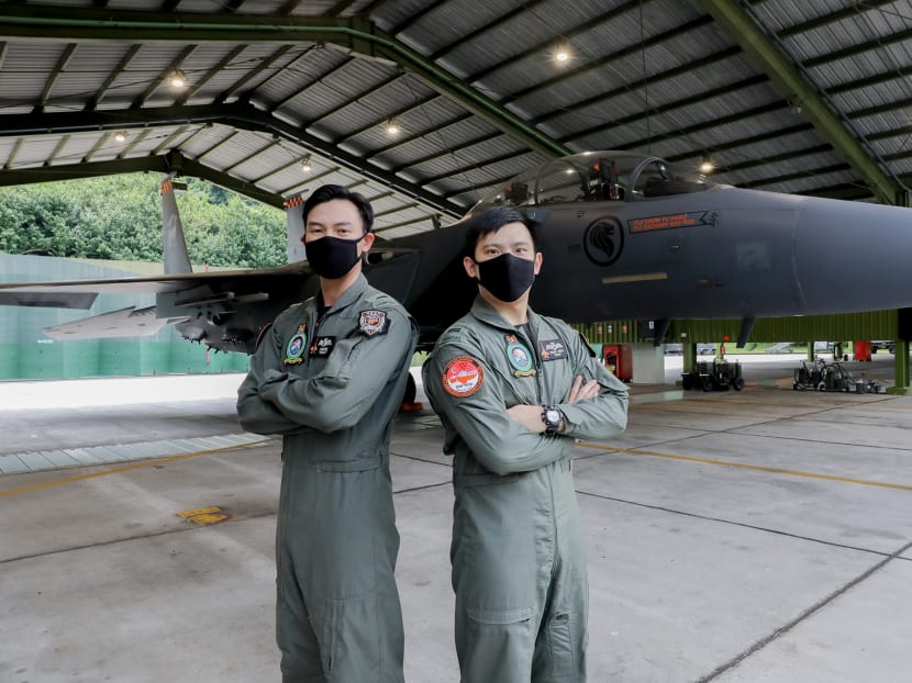 Captain Adam Eng Jun Chao (left) and Lieutenant Shidan Swah Yepeng with the F-15SG Fighter Aircraft at Paya Lebar Air Base on July 23, 2020 as they prepare for the National Day flypast. Captain Adam Eng Jun Chao (left) and Lieutenant Shidan Swah Yepeng with the F-15SG Fighter Aircraft at Paya Lebar Air Base on July 23, 2020 as they prepare for the National Day flypast.