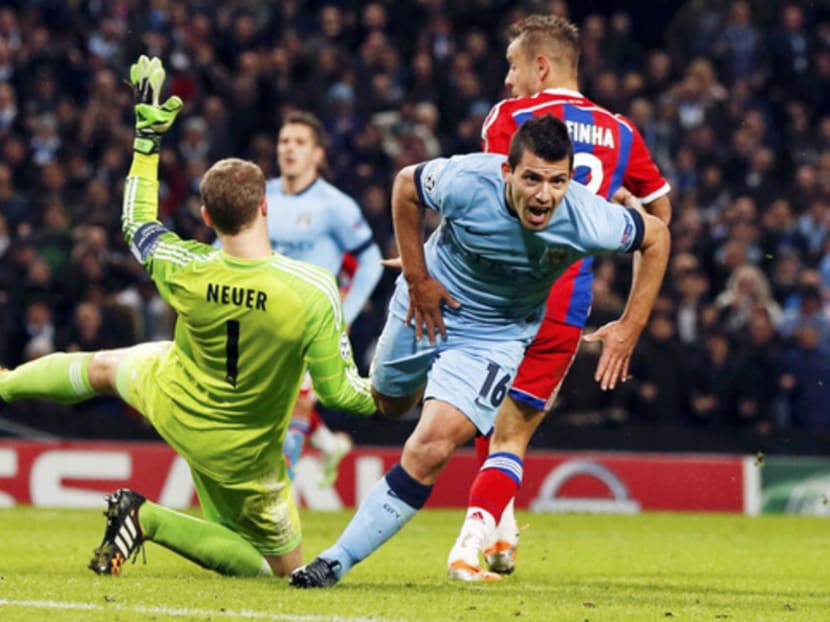 Aguero (right) was the hero of the hour with two goals in five minutes. Photo: REUTERS
