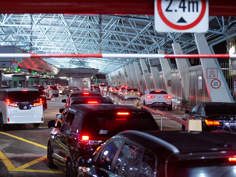Vehicles line up at the Woodlands Checkpoint enroute to Malaysia on April 1, 2022. 