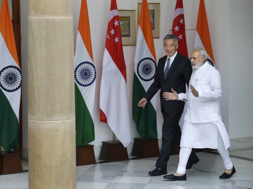 Indian Prime Minister Narendra Modi, right, talks with PM Lee Hsien Loong as they walk for a delegation level meeting, in New Delhi, India, on Oct 4, 2016. Photo: AP