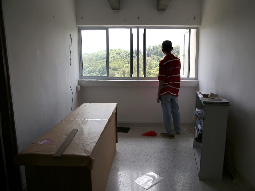 Mr Kuet, 59, looks out from a window in his Normanton Park apartment for the last time on Oct 4, 2018, before vacating the premises. It is the last day for residents to move out. The estate, which was sold en bloc, will be locked after this.