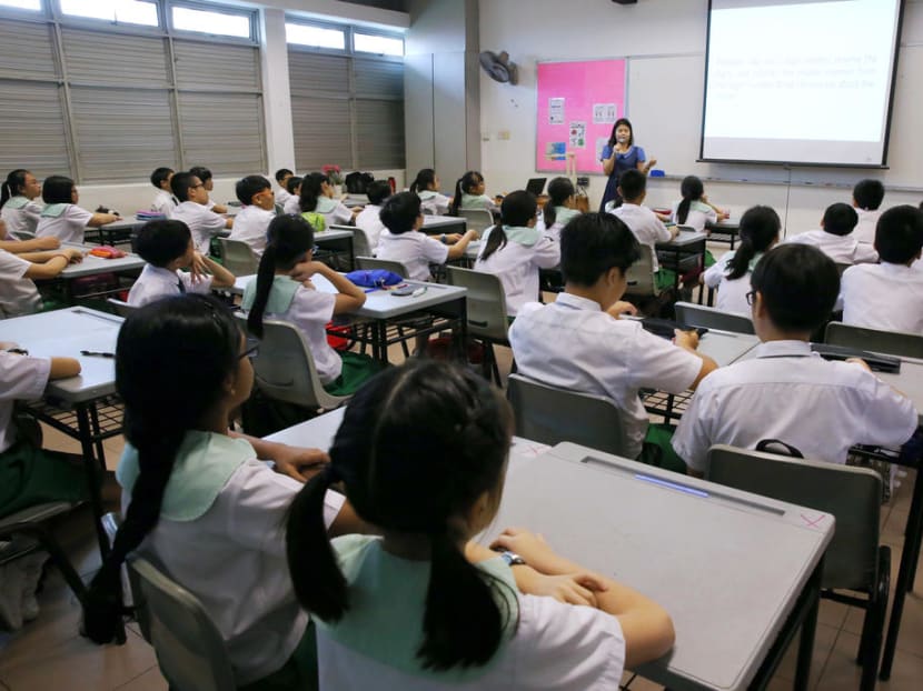 A Mathematics class with students from Woodgrove Primary School. The survey by education charity Varkey Foundation found that Singaporean teachers polled report that they are working longer hours per week (52 hours) than any other country aside from New Zealand (52.1 hours).