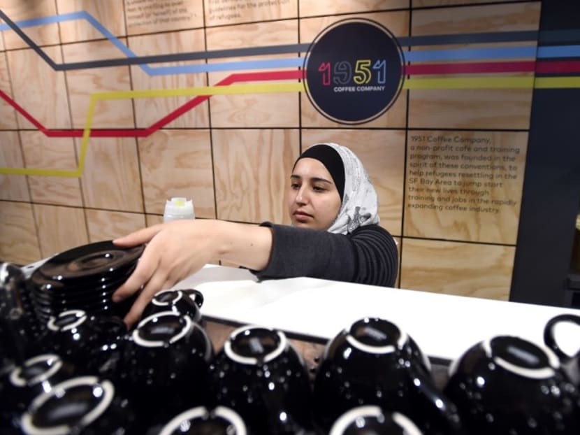 A Syrian employee who gives her name only as Rama working at 1951 Coffee Company. The 1951 Coffee Company is a non-profit organisation that promotes the well-being of the refugee community in California by providing employment to displaced people. Photo: AFP