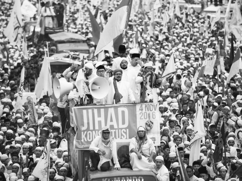 Hardline Muslim groups protesting against Jakarta’s Governor Basuki Tjahaja Purnama last year. South-east Asia is no less susceptible than the Middle East to the entrenchment of sectarian identity. Photo: Reuters