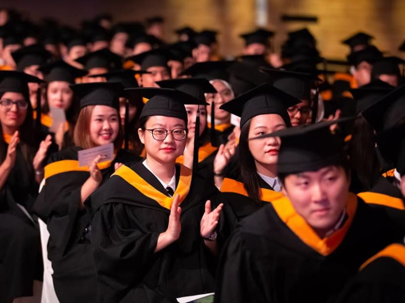 SMU graduands at the university's 2018 Commencement ceremomy. The author says institutes of higher learning with a focus on skills and technology such as SMU should look to expand to the region to help Singapore tap its skilled labour.