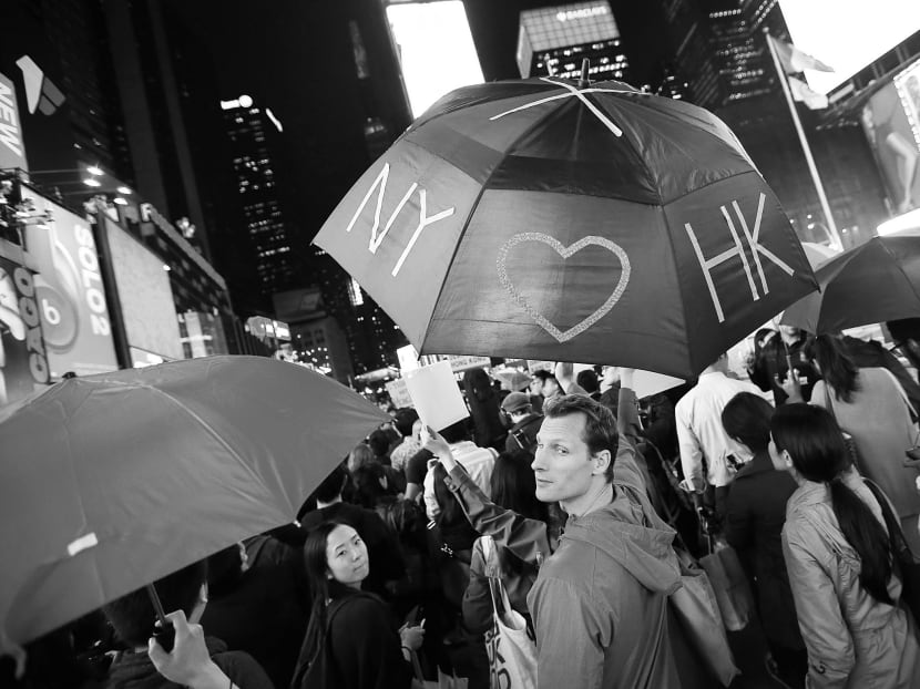 Protesters at New York’s Times Square last week calling for a stop to the repression 
of Hong Kong activists. China is not going to institute any major political change to copy Western models in the short term. Photo: AP