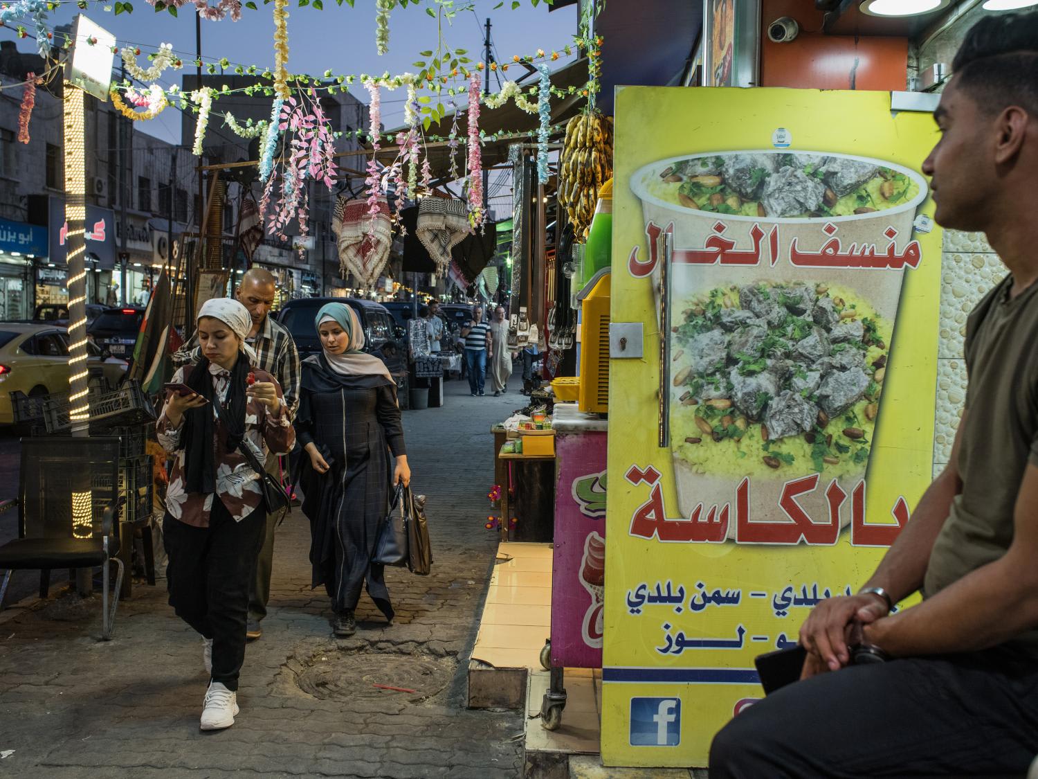 <p>A shop offers to-go cups of mansaf, a mutton and rice dish, in downtown Amman, Jordan on June 2, 2022. A restaurateur’s takeout offering of mansaf in a cup provides a novel way to enjoy Jordan’s most treasured delicacy, but some see the culinary innovation as an affront to the country’s most hallowed traditions.&nbsp;</p>
