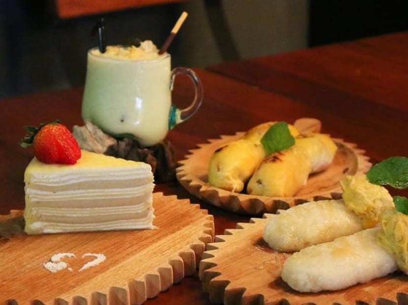The owner of Double Durian, Mr Huang Yong Xian, was tired of being ripped off and paying high prices for durian that was past its best. So he opened a durian cafe that makes the best of the famous fruit all year round. The owner of Double Durian, Mr Huang Yong Xian, was tired of being ripped off and paying high prices for durian that was past its best. So he opened a durian cafe that makes the best of the famous fruit all year round.
