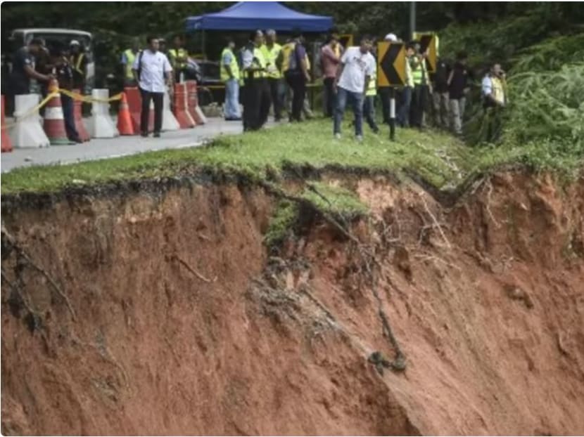 People inspect the damage after the landslide in Batang Kali, Selangor on Dec 16, 2022. 