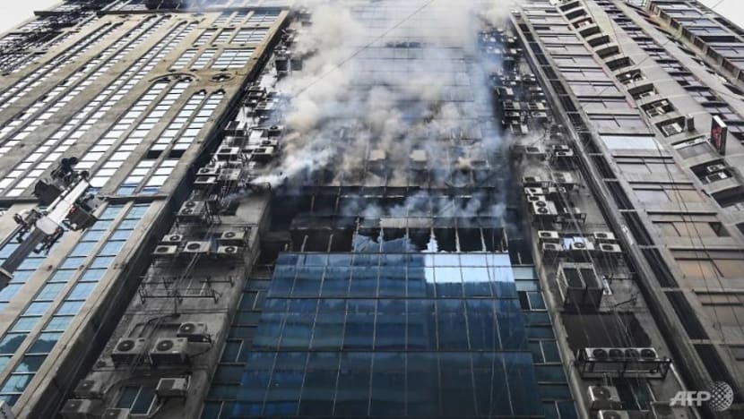 Workers jump to their deaths as Dhaka office block fire kills 19 Workers jump to their deaths as Dhaka office block fire kills 19