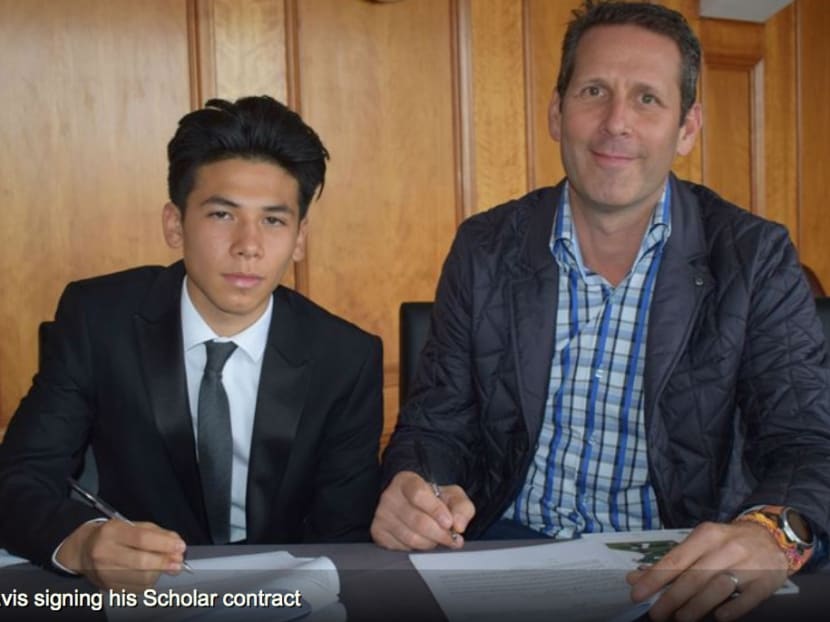 Ben Davis and his father, Harvey, signing the two-year scholarship agreement with English club Fulham on Tuesday, July 11. Photo: Harvey Davis