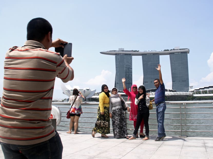 People posing for a photograph at Marina Bay. TODAY file photo