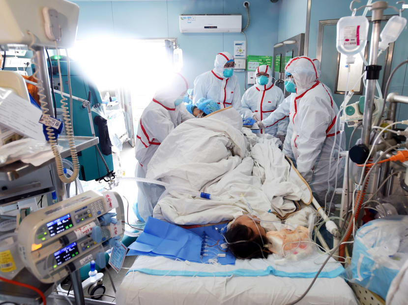 An H7N9 bird flu patient being treated in a hospital in Wuhan, central China’s Hubei province, on Feb 12. Several Chinese cities have banned live poultry trade, which authorities say has proved effective. Photo: AFP