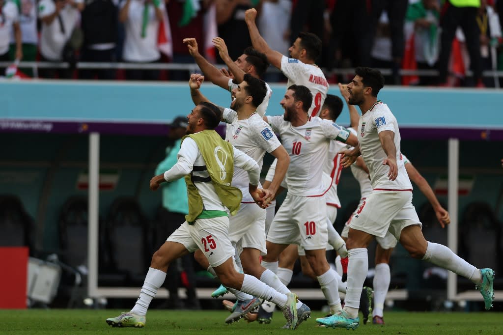 Iran's players celebrate their victory during the Qatar 2022 World Cup Group B football match between Wales and Iran at the Ahmad Bin Ali Stadium in Al-Rayyan, west of Doha on Nov 25, 2022. Iran's players celebrate their victory during the Qatar 2022 World Cup Group B football match between Wales and Iran at the Ahmad Bin Ali Stadium in Al-Rayyan, west of Doha on Nov 25, 2022.