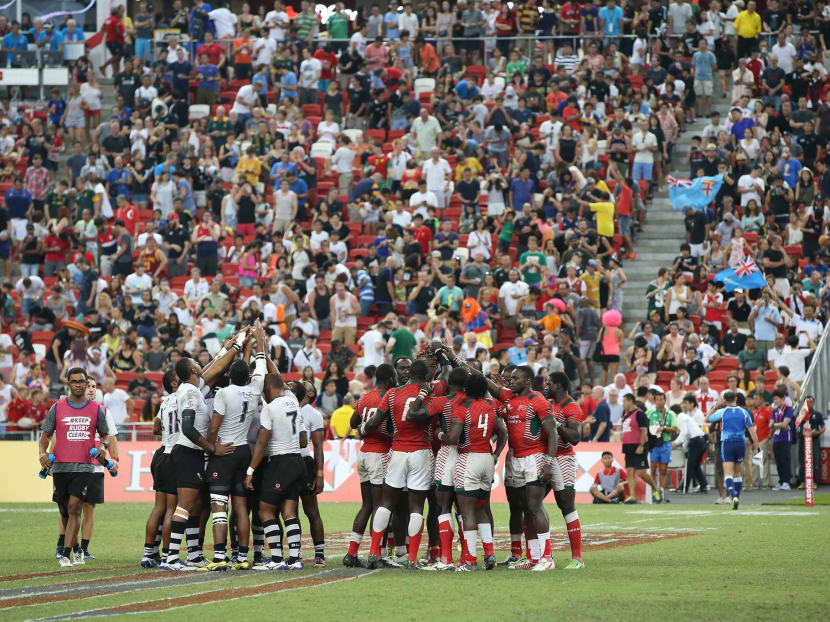 The Fiji (left) and Kenya teams after their thrilling final at the National Stadium last year.  Photo: Singapore Sevens Facebook Page