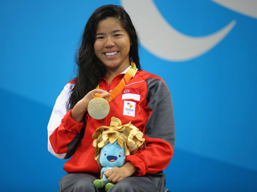 Gold medalist Yip Pin Xiu celebrates on the podium at the medal ceremony for the Women's 100m Backstroke — S2 Final on Day 2 of the Rio 2016 Paralympic Games at the Olympic Aquatics Stadium on Sept 9, 2016 in Rio de Janeiro, Brazil. Photo: Getty Images