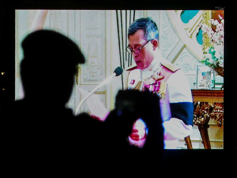 A military officer takes a photo as a television screen shows Thailand's new King Maha Vajiralongkorn Bodindradebayavarangkun speaking after he accepted an invitation from parliament to succeed his father, the late King Bhumibol Adulyadej, on Dec 1. Photo: Reuters
